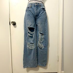 blue high rise, wide legged, ripped jeans